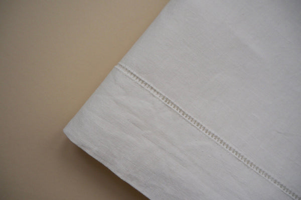 White flat sheet with open-work hand embroidery