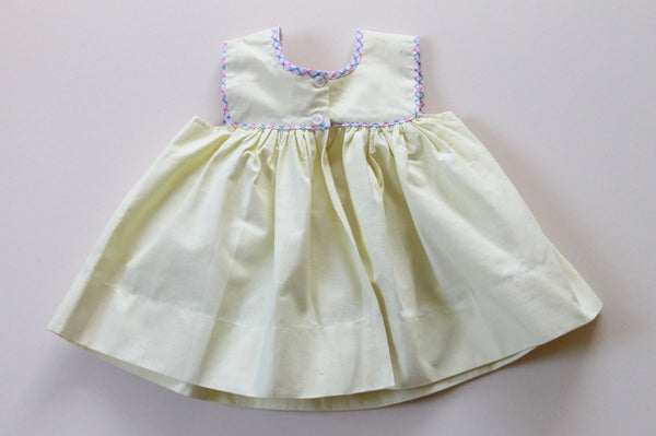 hand-knitted vintage baby dress light yellow back view made in France