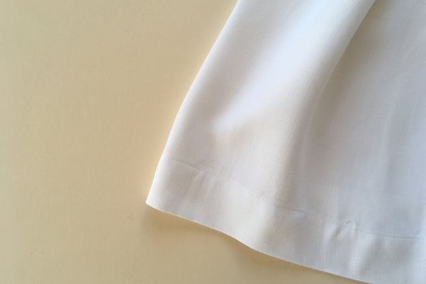 White dress with a blue ribbon - 12/18m